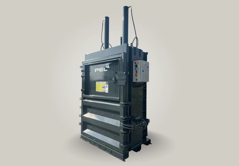 Robust PEL5000A baler with lever-action door handle and spacious aperture for safe, single-person operation.